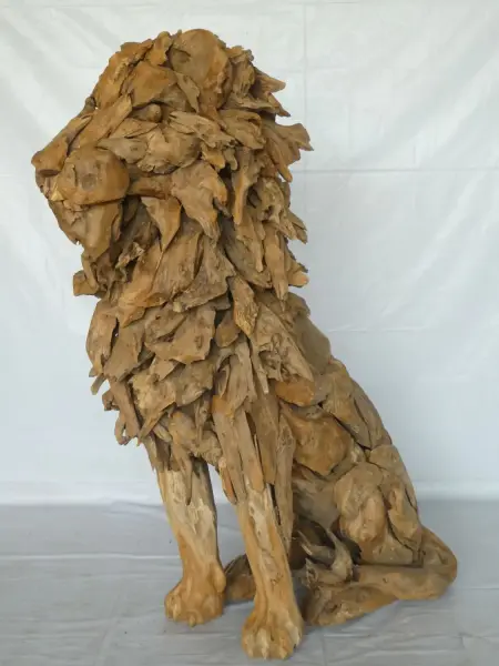 Product image 1 of the product “Seated royal Lion made from teak root pieces. About 100cm length and 150cm height. ”
